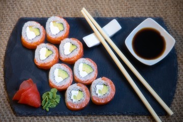 Sushi rolls closeup on burlap background
