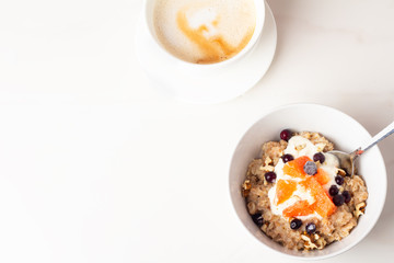 oatmeal with fruit and coffee for breakfast