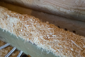 Chips and sawdust during the construction of house. Slivers of w