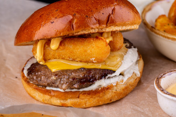 Burger with cheese and cutlet with cheese sticks