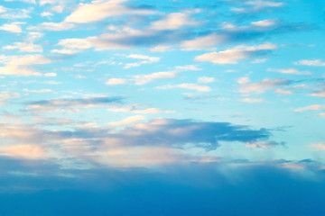 Fototapeta na wymiar Blue sky with sunlit clouds during sunrise_