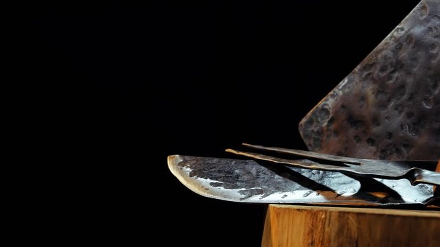 Horizontal panorama of butcher meat knife, cleaver and fork on black background