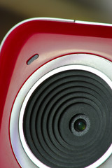 red and white webcam, close-up on the lens