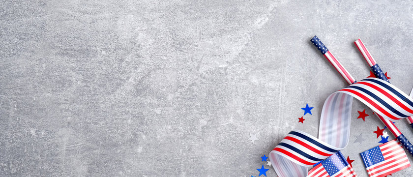 Happy Presidents day or Independence Day, Labor day, Memorial day banner mockup with American flags, grosgrain ribbon, drinking straws, confetti stars on concrete stone background.