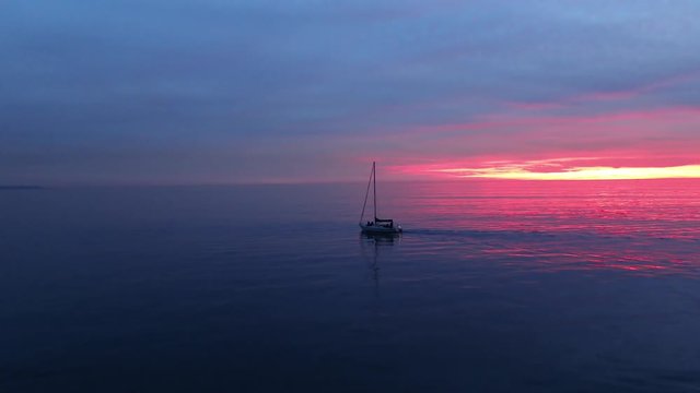 Sailbot on sunset aerial view