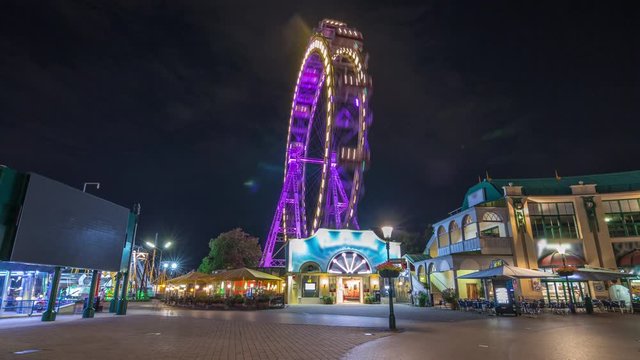 Wiener Riesenrad in Prater night timelapse hyperlapse - oldest and biggest ferris wheel in Austria. Symbol of Vienna city. View from park