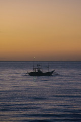 Fototapeta premium Boat in sunrise