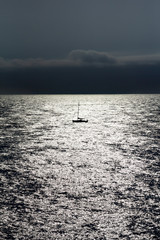 sailboat silhouette in the sea