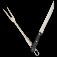 Serving Fork and Carving Knife Isolated on Black Background