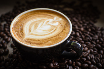hot latte art in red mug