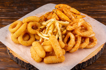 Fries, onion rings, squid rings, cheese sticks