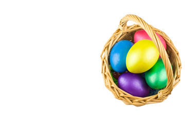 happy Easter, colored eggs in a basket and spring flowers on a white background, spring Orthodox Christian and Catholic holiday, banner with space for text
