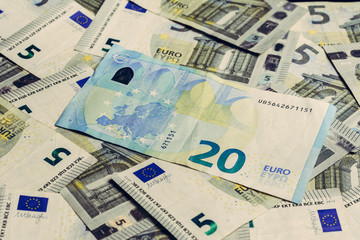 European money is in textures, denominations of 20 and 5 euros.