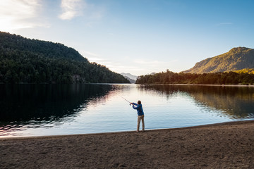 Fototapeta na wymiar Man fishing on the lake in Argentina