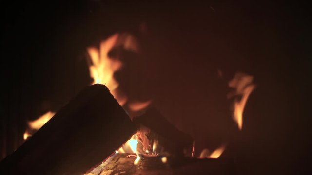 Closeup of fire in a water heating boiler. The boiler runs on solid fuel, wood.