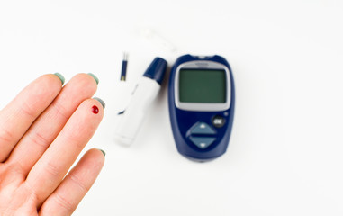 device for measuring blood sugar-blood glucose meter, syringe pen and test strip on a white background, the concept of diagnosis of diabetes