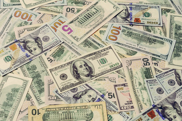 The dominant currency of the world, dollar bills in textured form.