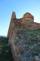 View to medieval castle La Calahorra in the Sierra Nevada mountains at the sunset, Granada, andalucia, Spain