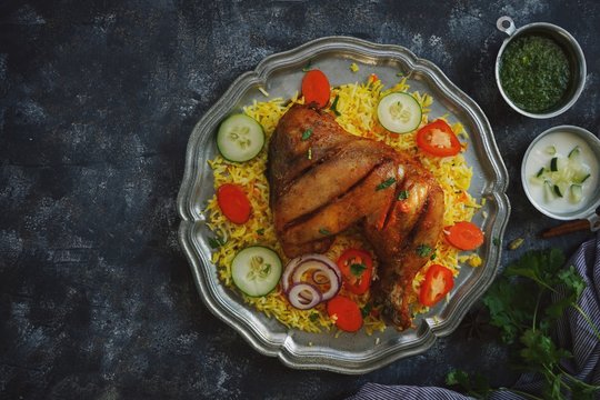 Chicken Kabsa/ kuzhi Mandhi or Mandi Biryani served with yogurt mint chutney