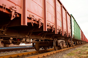 Fototapeta na wymiar Freight train wagon on rails close up