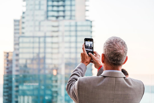 Man taking picture on cell phone