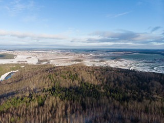 Winter nature, forest, river, village. View from above. Shooting from a copter.