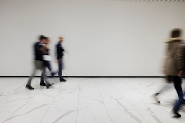 People out of focus at the airport