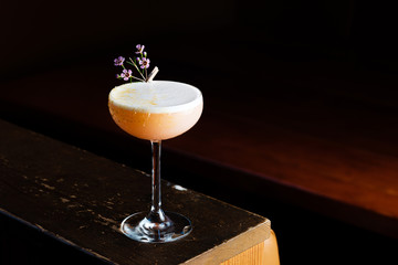 Cocktail in a glass with a flower