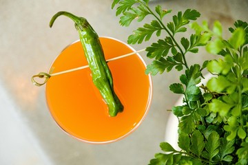 Cocktail in a glass with a pepper