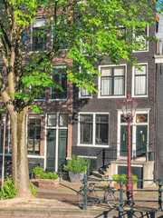 Amsterdam canals and typical houses with clear summer sky