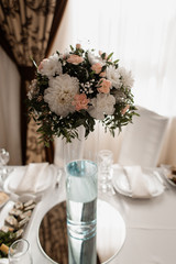 Table serving with a floral centerpiece at the restaurant