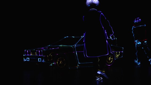 Doc in LED costume by time machine in the past