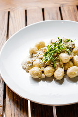 Plate of gnocchi on a table