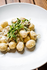 Plate of gnocchi on a table