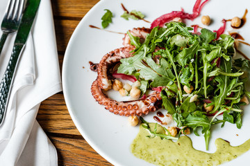 Salad with octopus on a plate