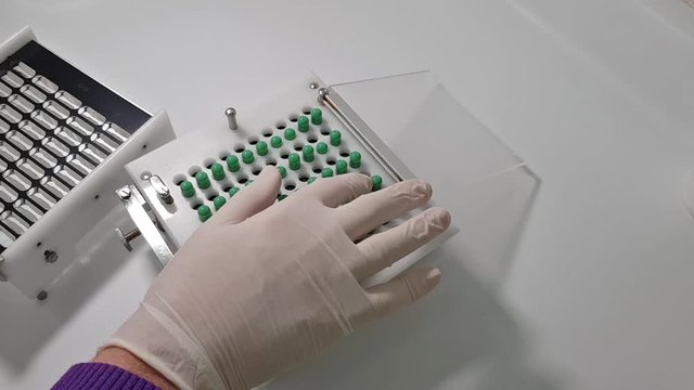 Green capsules machine in a pharmacy prescription lab