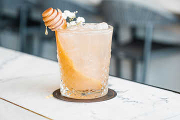 Cocktail drink with honey drip