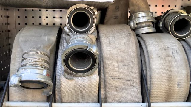 The fire hose on the side of the firetruck