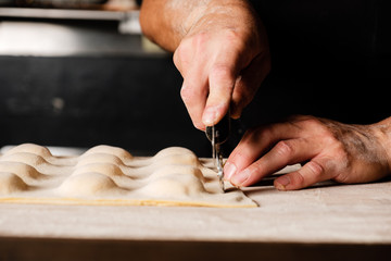 Chef making pasta dough in kitchen