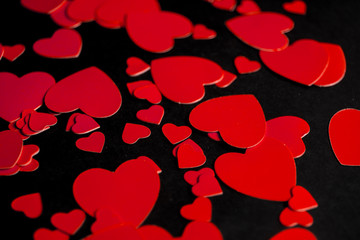 Background with red hearts. Black background. Banner. Red hearts on a black background. St. Valentine's Day