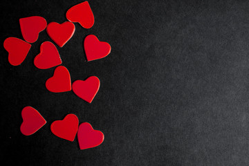 Background with red hearts. Black background. Banner. Red hearts on a black background. St. Valentine's Day