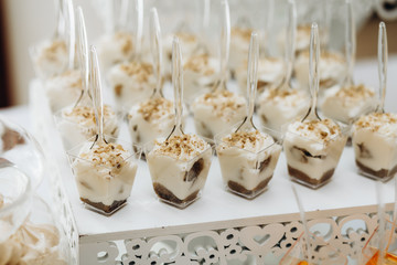 Front view of candy bar full with pudding desserts