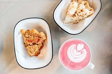 Slices of pie and coffee on table