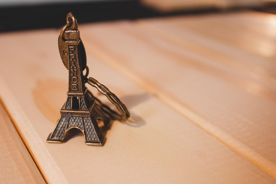 Bronze Souvenir Keychain On A Wooden Base