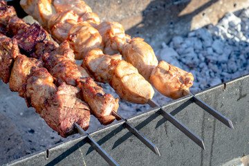 Meat on a skewer. Cooking kebab.