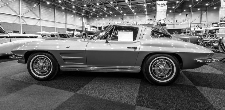 MAASTRICHT, NETHERLANDS - JANUARY 15, 2016: Sports car Chevrolet Corvette C2 "Split Window", 1963. Black and white. International Exhibition InterClassics & Topmobiel 2016