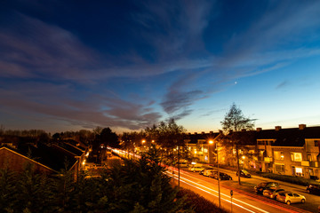 Dusk dark blue sky with traffic in town