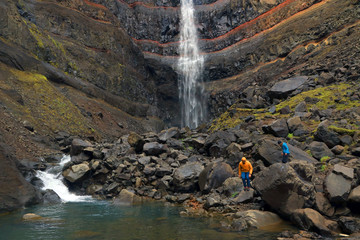 Hengifoss Canyon with the Hengifoss Waterfall, the third highest waterfall in Iceland is surrounded...