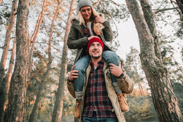 Couple travelers is so fun in the forest. Concept of trekking, adventure and seasonal vacation.