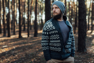 Outdoor portrait of handsome bearded man . Casual autumn fashion portrait